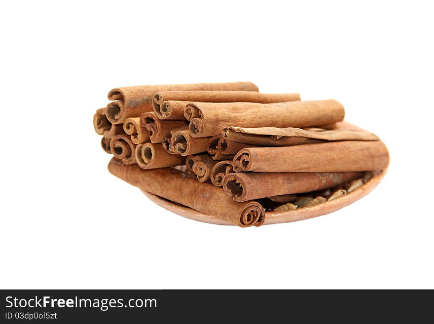 Cinnamon on a plate on a white background