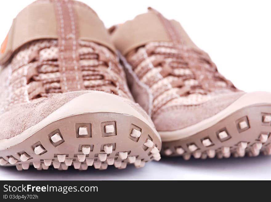 Brown trainers on a white background