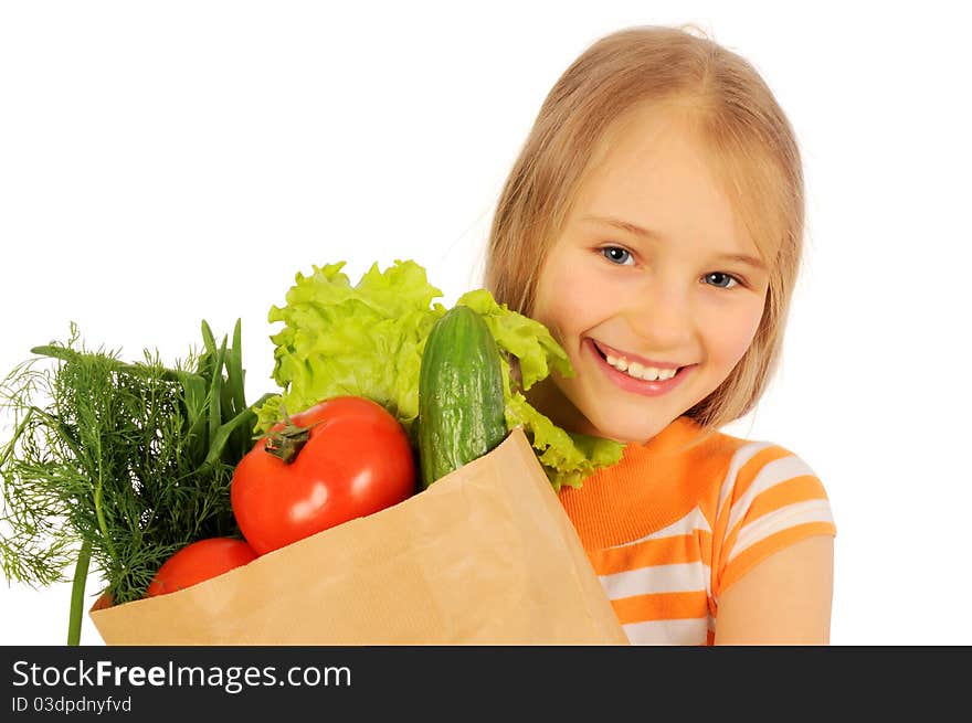 Cute girl with paper bag of vegetabl. Cute girl with paper bag of vegetabl