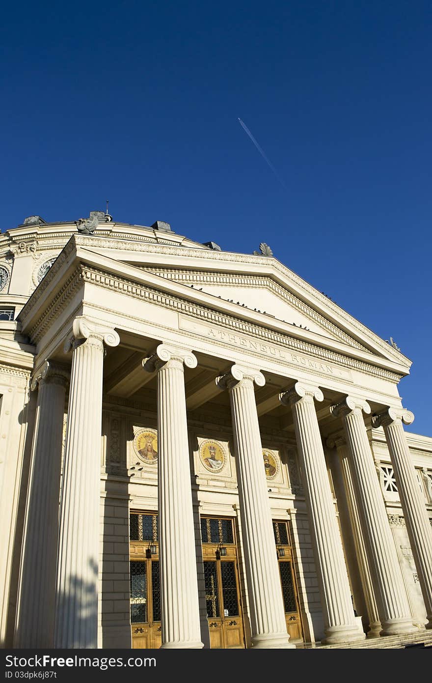 Athenaeum entrance with columns on a clear sky day