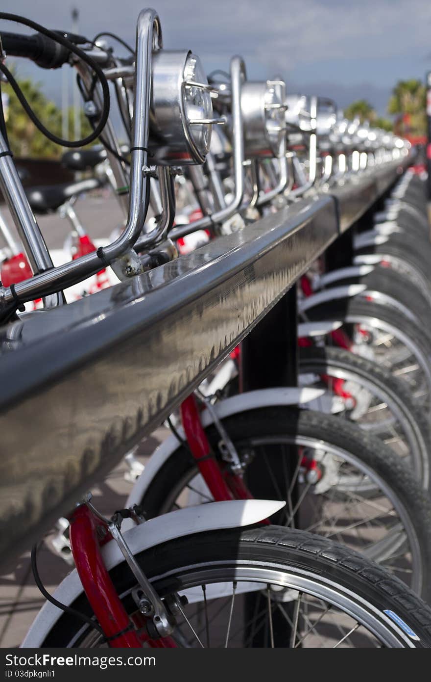 Many bicycles for rental waiting for their riders. Many bicycles for rental waiting for their riders