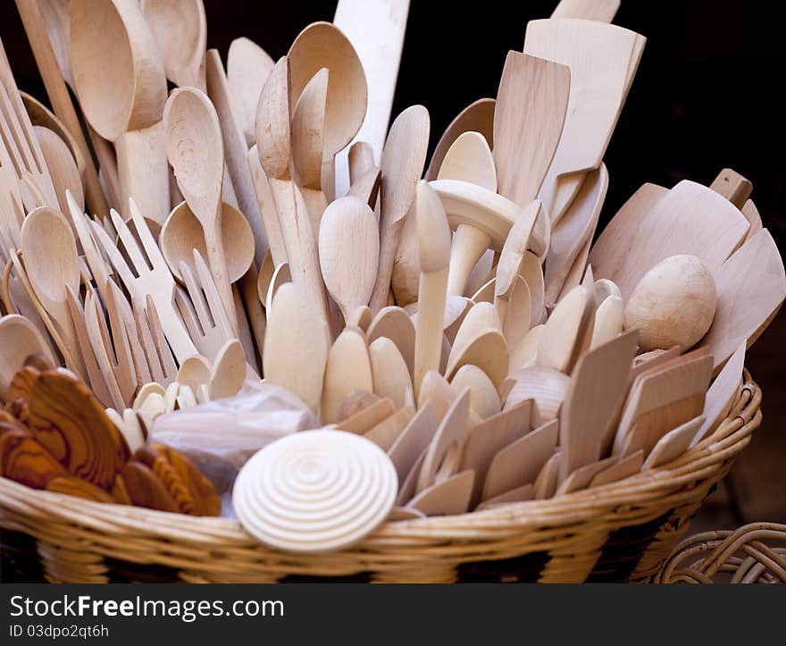 Wooden spoons inside a wicker basket