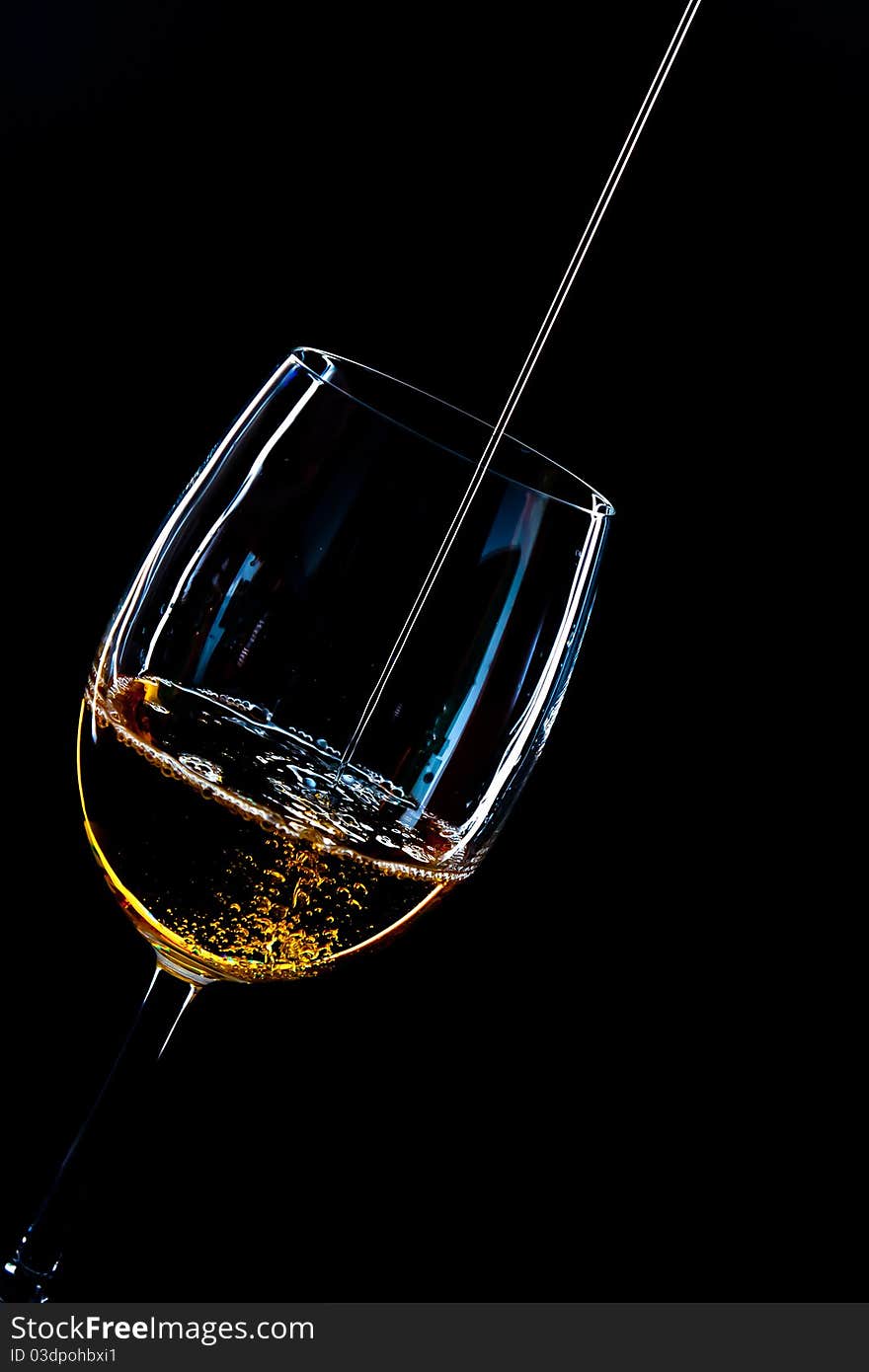 A cup of whisky on black background. A cup of whisky on black background