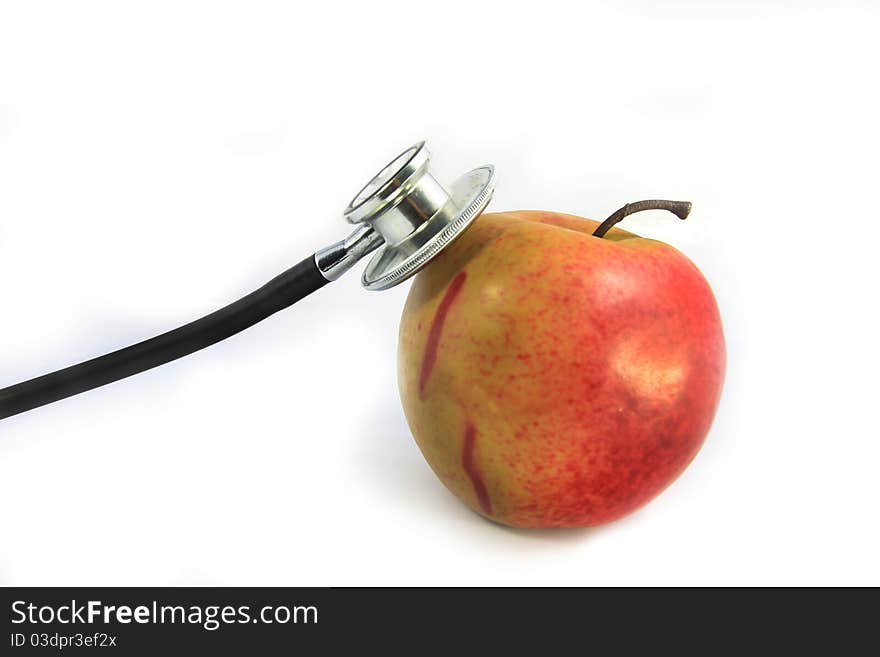 Stethoscope and red apple on white. Stethoscope and red apple on white