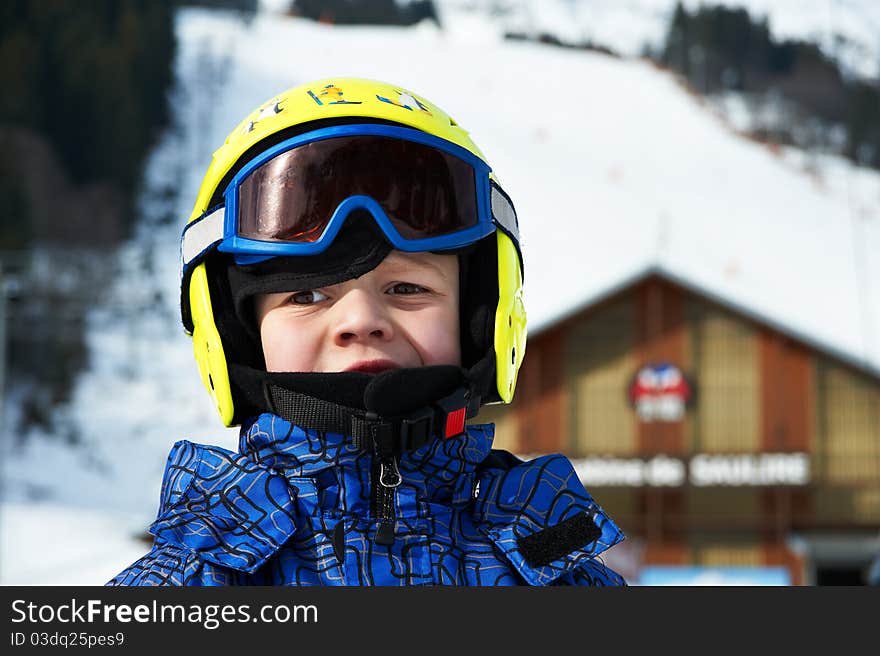 Portrait of child wearing helmet and glasses mask