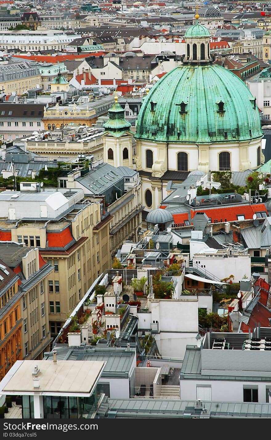 Cityscape of Vienna with St. Peter's church and gardens on a roof