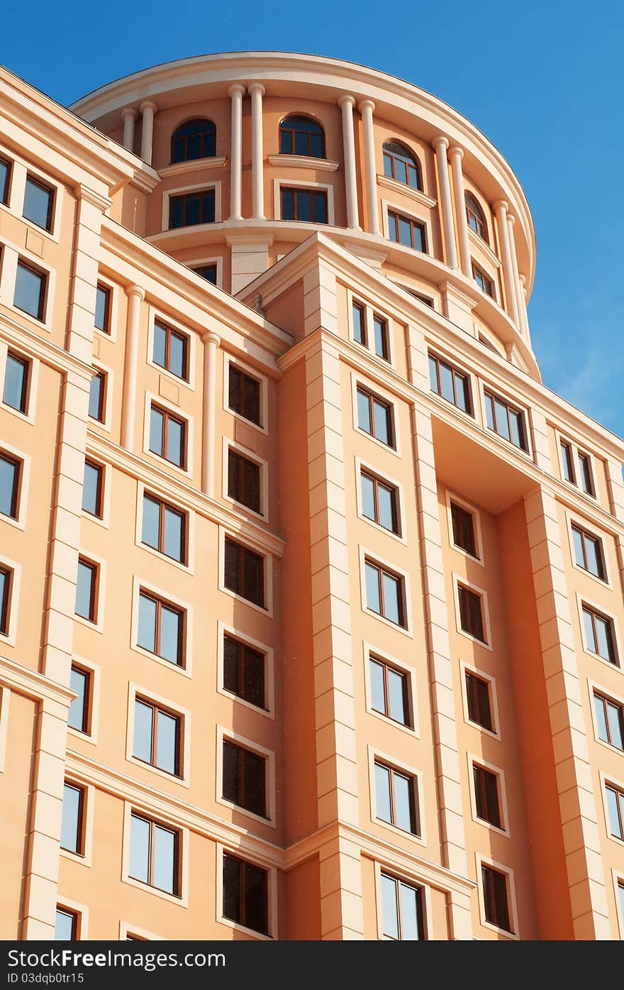 Old-fashioned office building on a blue sky. Old-fashioned office building on a blue sky