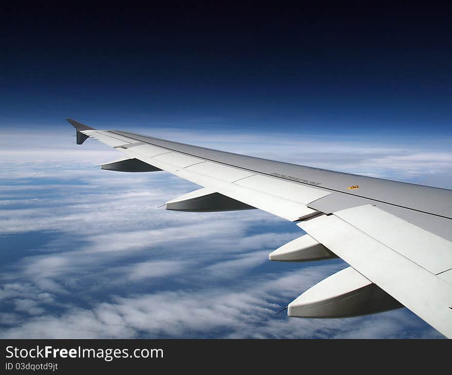 Sky landscape whit clouds and wing from airplane window. Sky landscape whit clouds and wing from airplane window