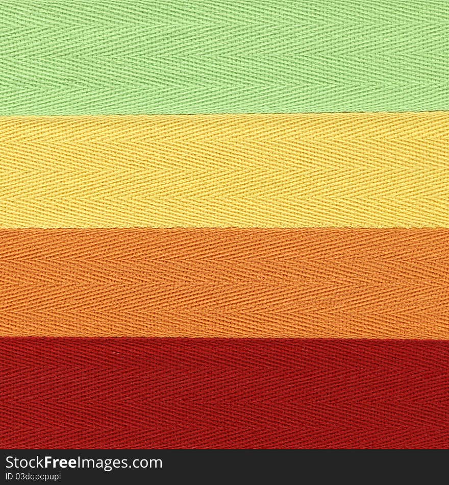 Multicolored textile ribbons as background. Multicolored textile ribbons as background