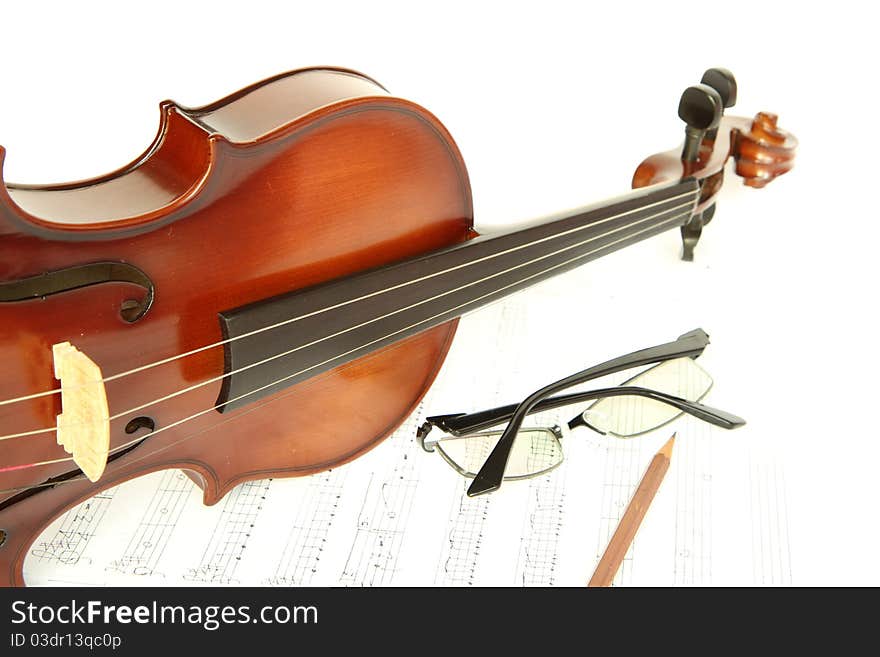 Violin on note with glasses and pencil