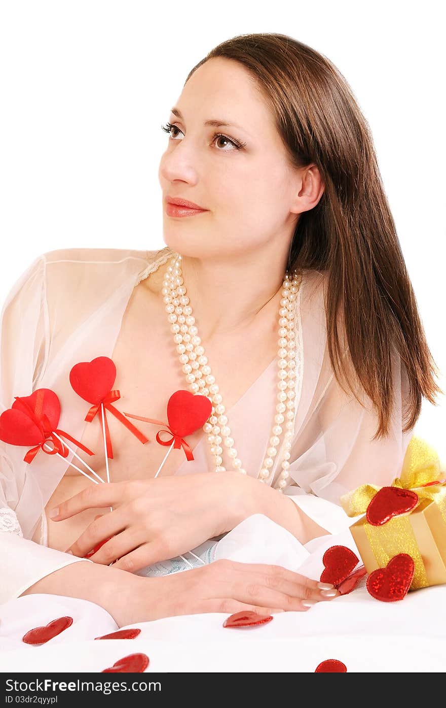 Woman holds red hearts