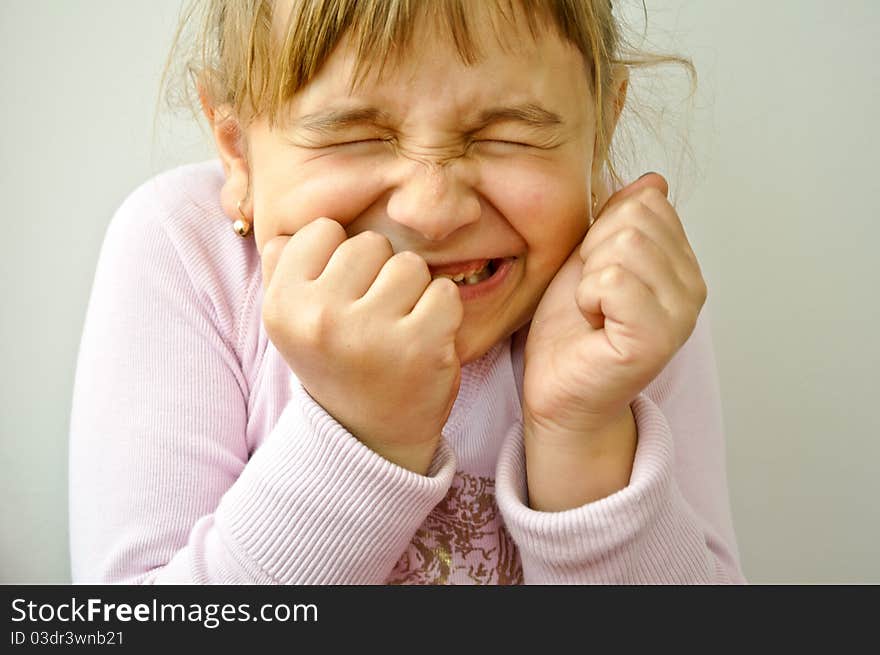 Beautiful blonde little girl being joyful