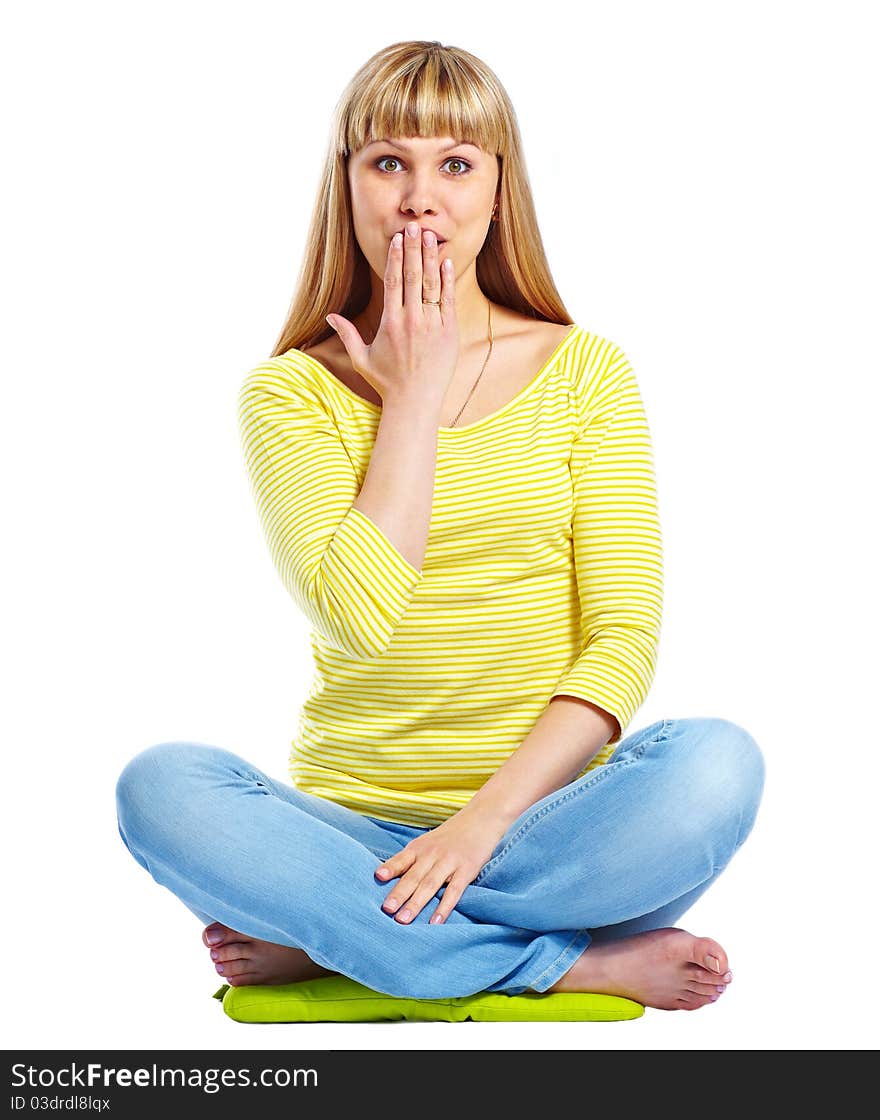 Attractive caucasian girl sitting on floor cover her mouth with hand isolated over white. Attractive caucasian girl sitting on floor cover her mouth with hand isolated over white