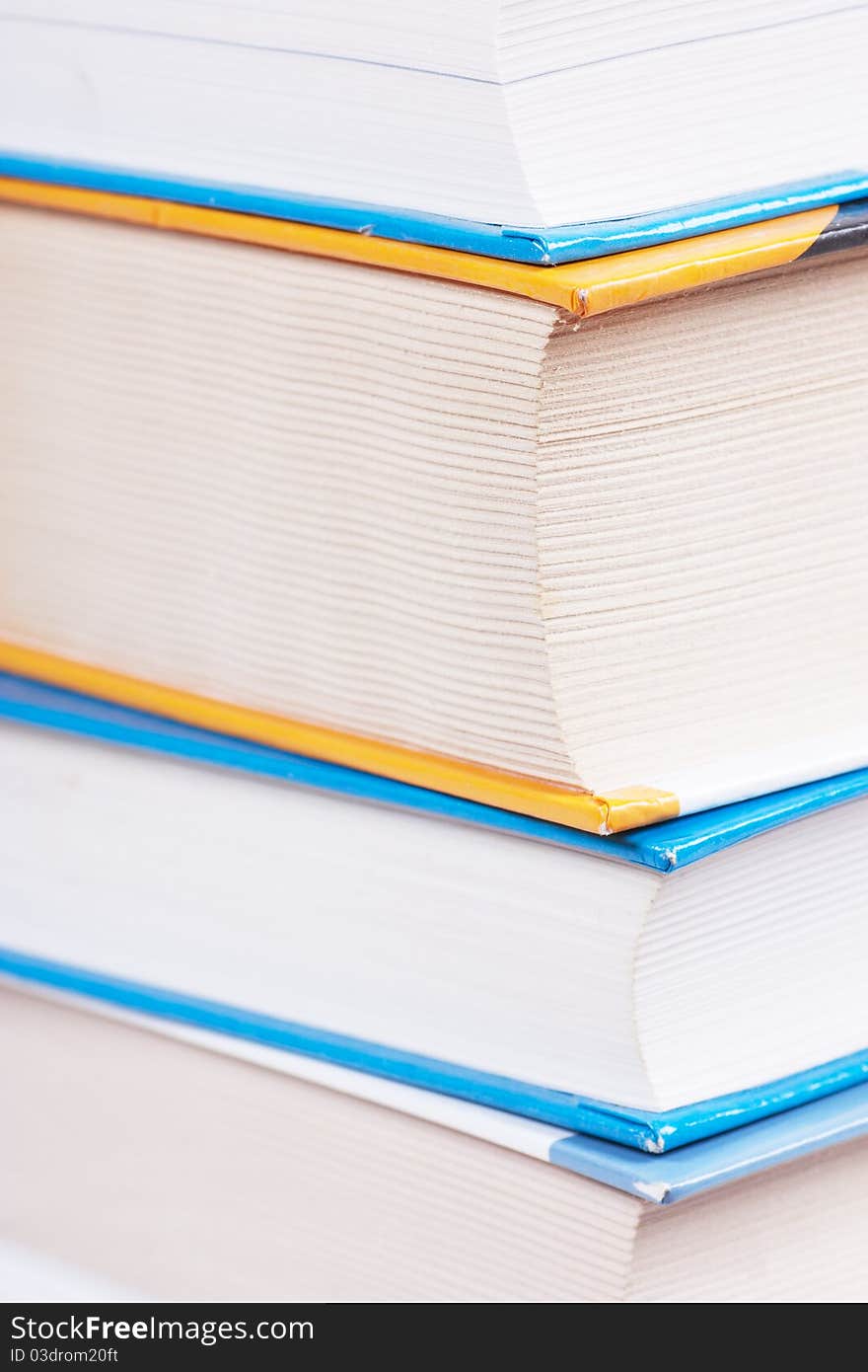 A stack of books. Closeup view.