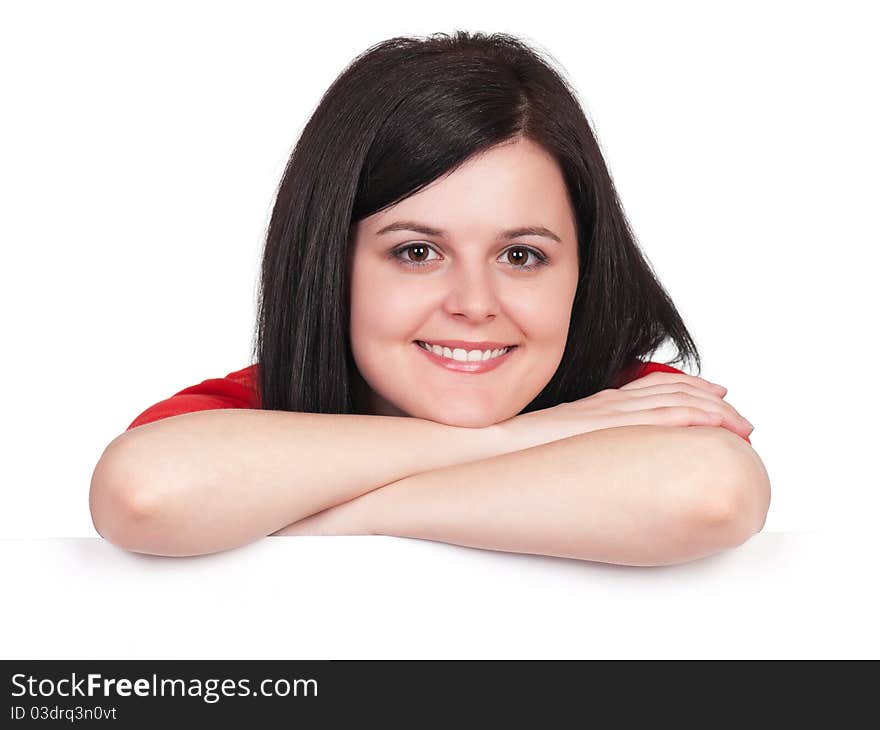 Portrait of a beautiful young woman with blank billboard on white background