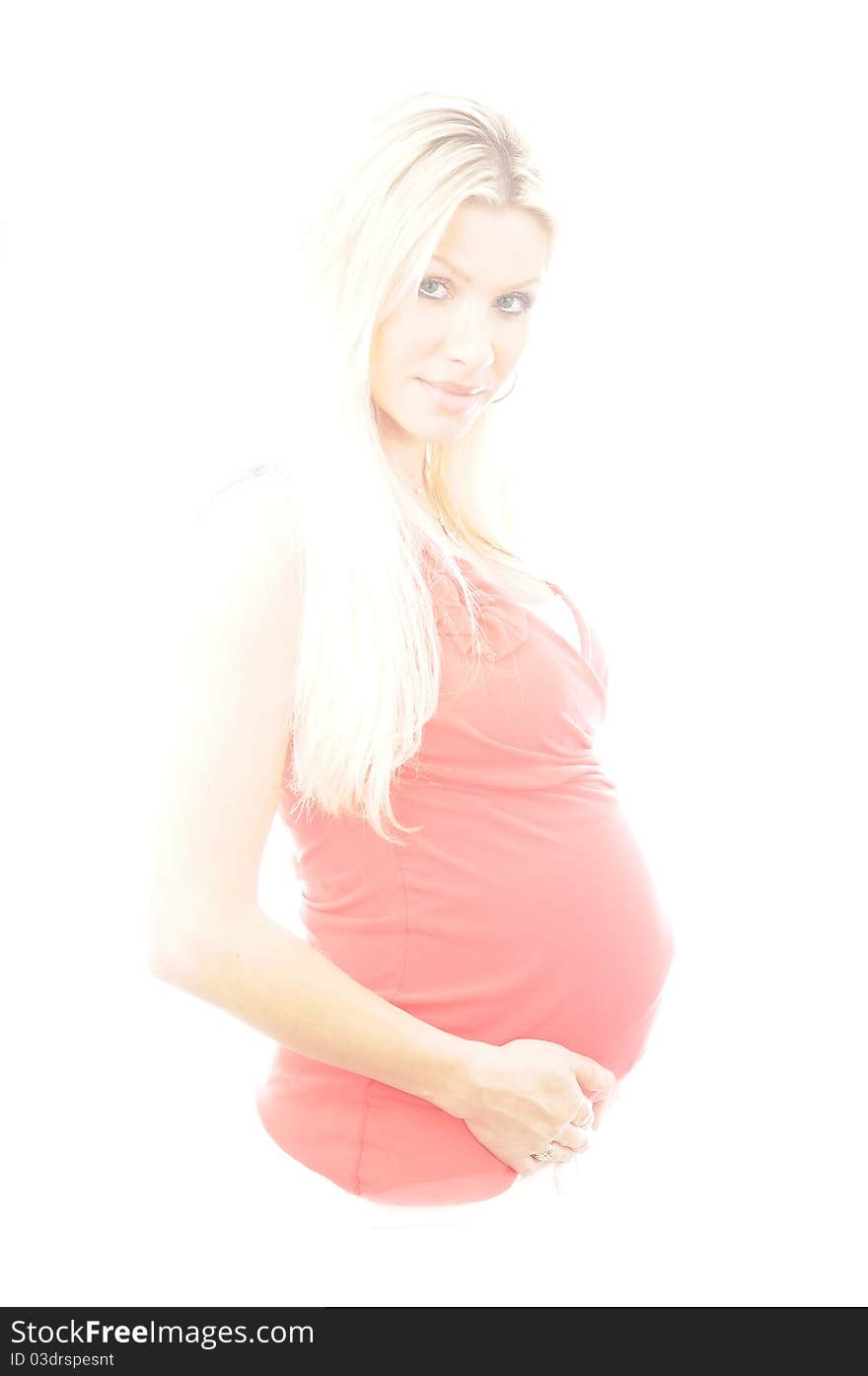 IN studio photograph of a lovely pregnany woman. IN studio photograph of a lovely pregnany woman