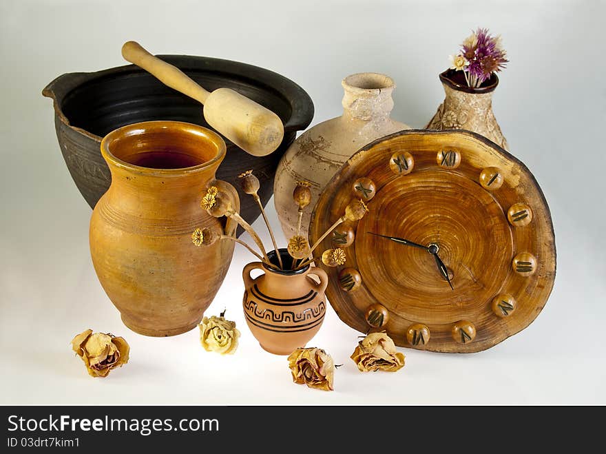 Antique tableware and watches assembled in a single track on a white background. Antique tableware and watches assembled in a single track on a white background.