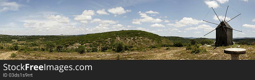 Old wooden windmill from Oeste region and panoramic view of the landscape, Portugal. Old wooden windmill from Oeste region and panoramic view of the landscape, Portugal