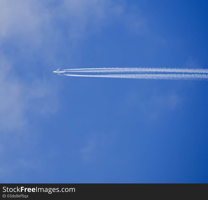 Jet contrail in deep blue sky