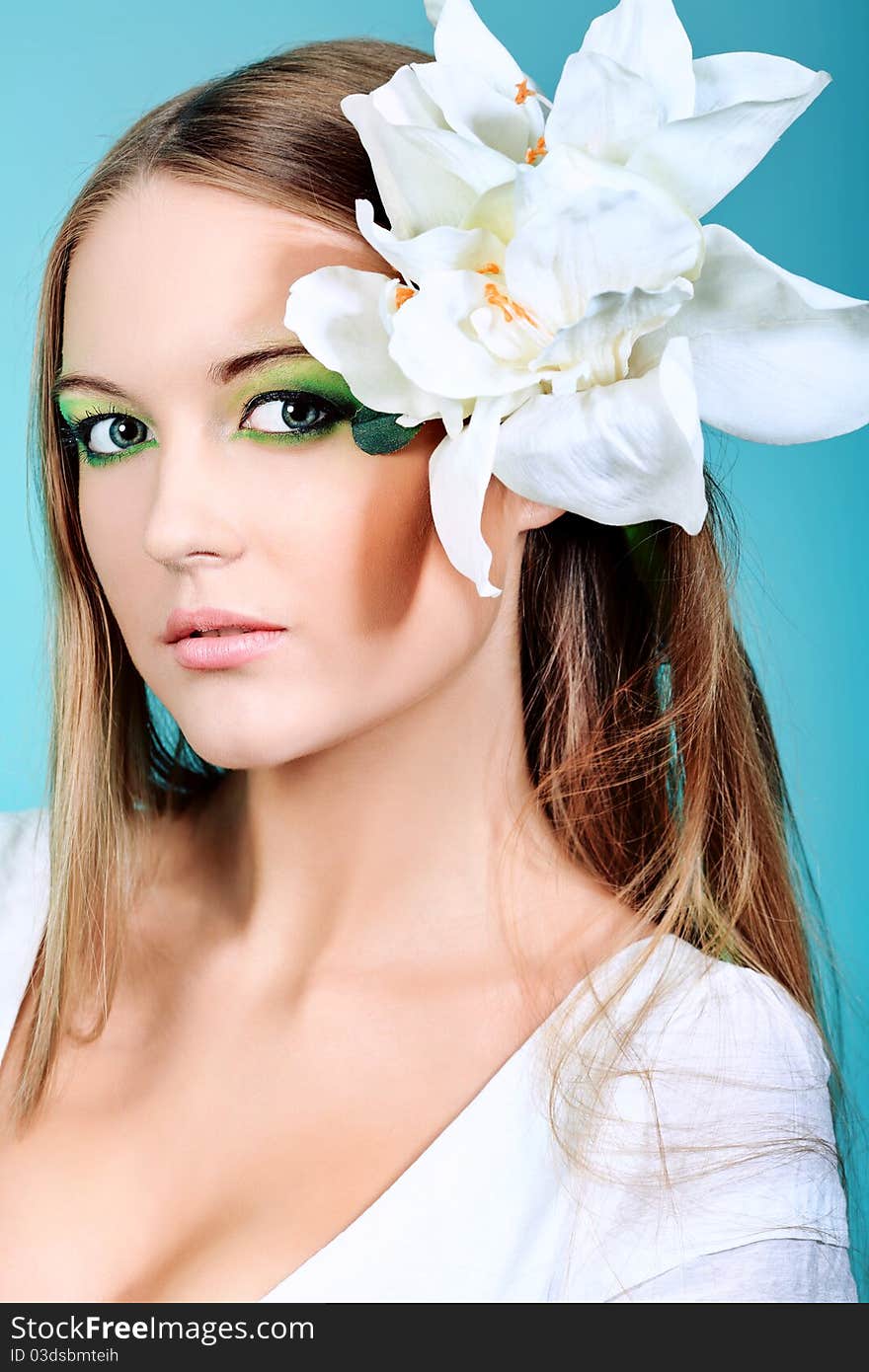 Portrait of a beautiful young woman with spring make-up. Beauty, fashion. Portrait of a beautiful young woman with spring make-up. Beauty, fashion.