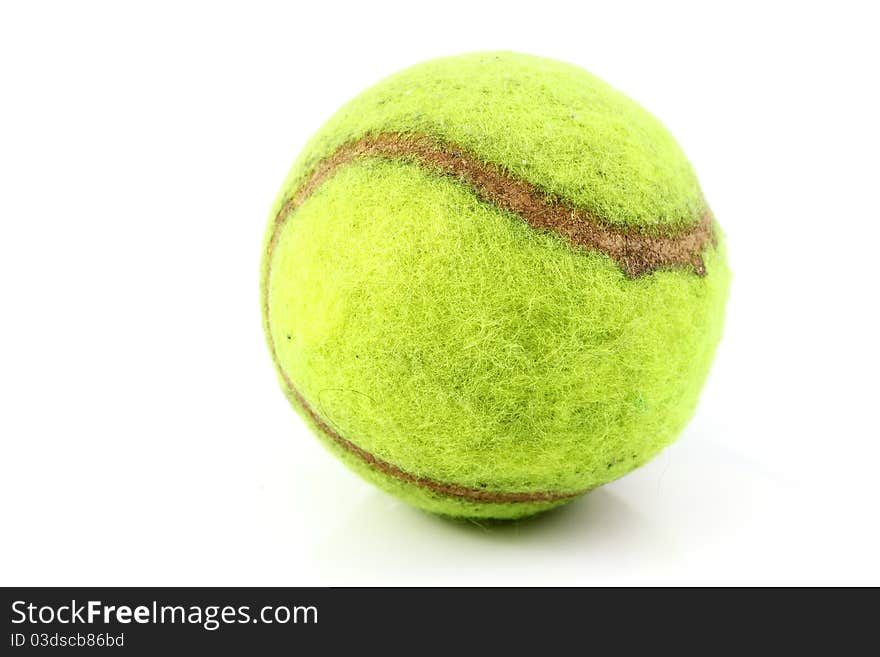 Old tennis ball on white blackground