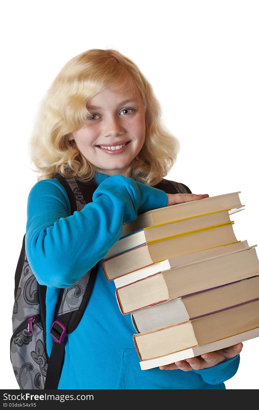 Young blonde Schoolgirl with schoolbag holds a pile of books and smiles.Isolated on white background. Young blonde Schoolgirl with schoolbag holds a pile of books and smiles.Isolated on white background.