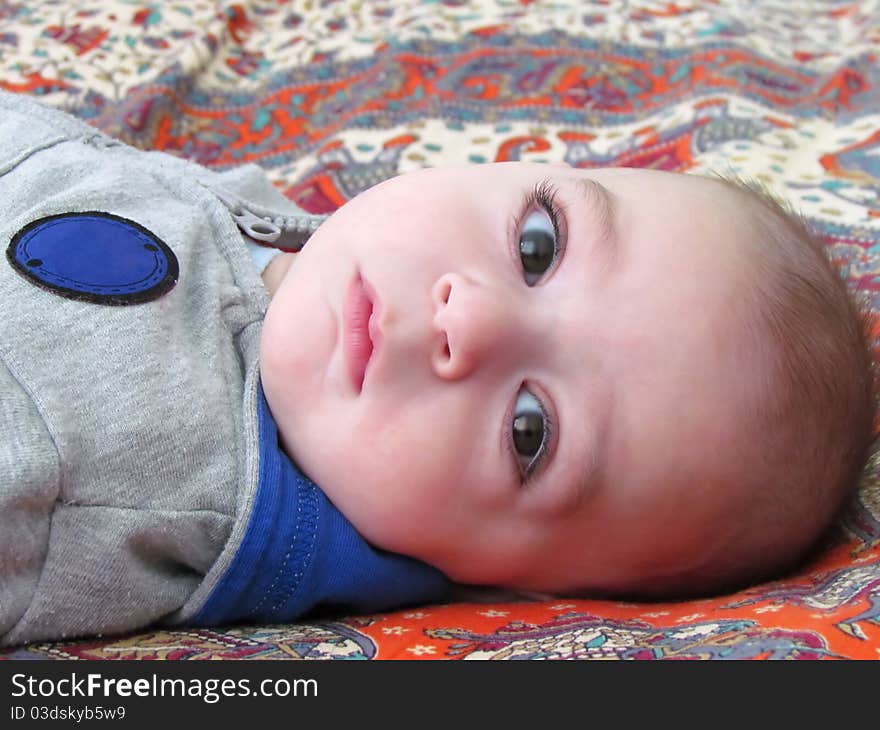 Cute baby boy with attractive glance