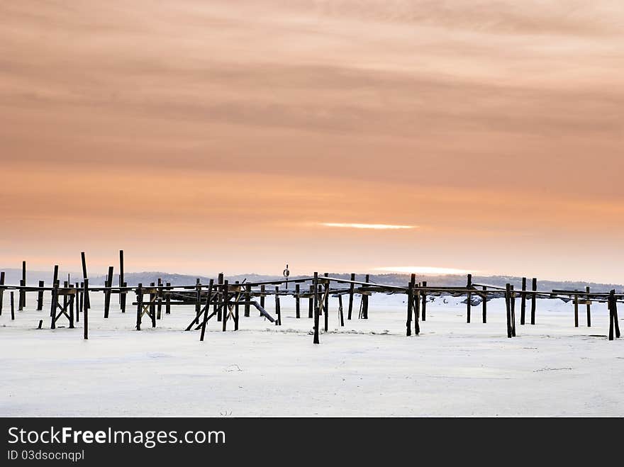 Red sky and wood pier on the Onsala fjord