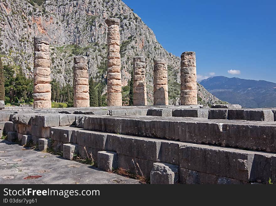 The ruins of Temple of Apollo in the archaeological site of Delphi in Greece; Delphi was believed to be the centre of the earth. The ruins of Temple of Apollo in the archaeological site of Delphi in Greece; Delphi was believed to be the centre of the earth