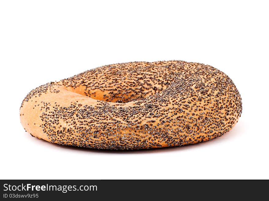 One bagel with poppy seeds on white