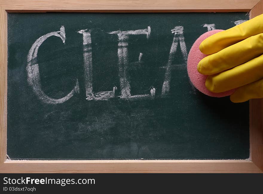 Hand with sponge clean blackboard. Hand with sponge clean blackboard