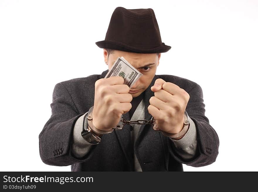 Man with handcuff and dollar bank notes. Man with handcuff and dollar bank notes