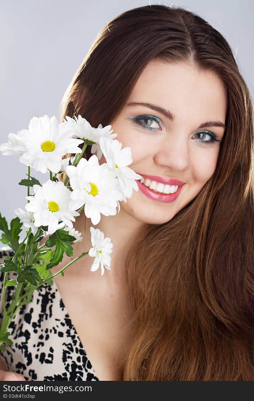 Portrait of beautiful young happy woman with flowers. Portrait of beautiful young happy woman with flowers