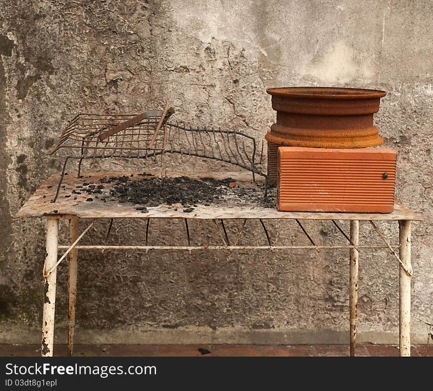 Makeshift metal grille on table. Makeshift metal grille on table