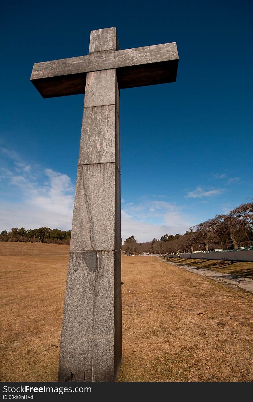 Christian cross on a field, with a nice blue sky