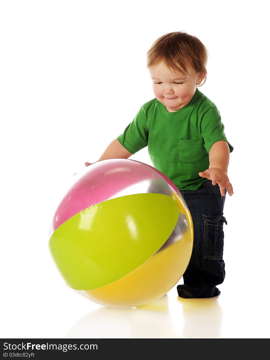 An adorable toddler catching a colorful beachball. Isolated on white. An adorable toddler catching a colorful beachball. Isolated on white.