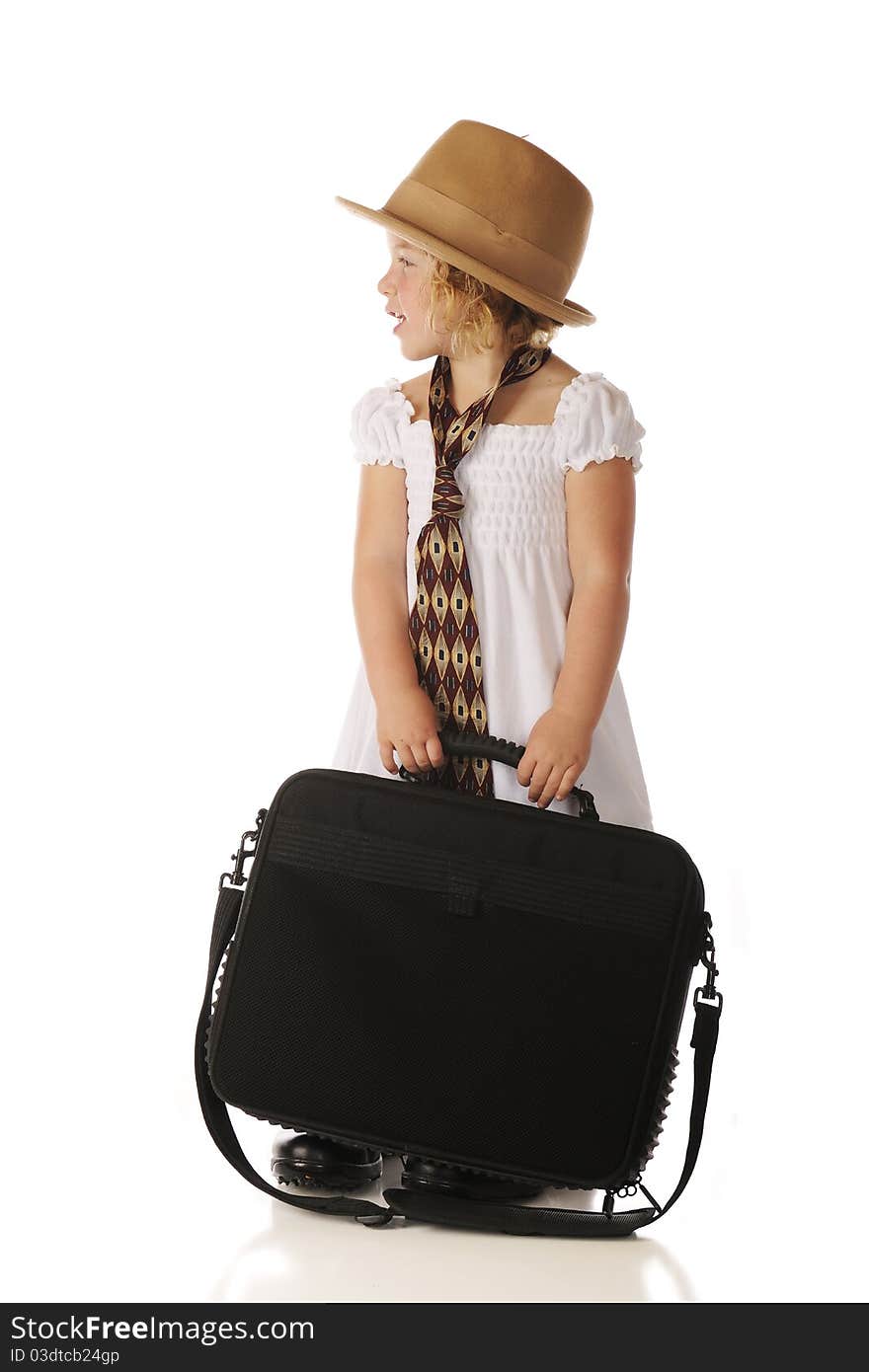 Profile of an adorable preschooler waiting to go to work with her grandpa. She's holding a computer case while wearing a sundress and an old-style felt hat, wide tie and men's shoes. Isolated on white. Profile of an adorable preschooler waiting to go to work with her grandpa. She's holding a computer case while wearing a sundress and an old-style felt hat, wide tie and men's shoes. Isolated on white.