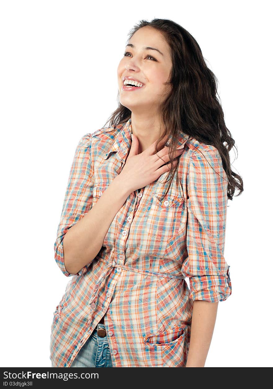 Beautiful and happy young woman with dark wavy hair laughing and looking up away from the camera. Isolated on white background.