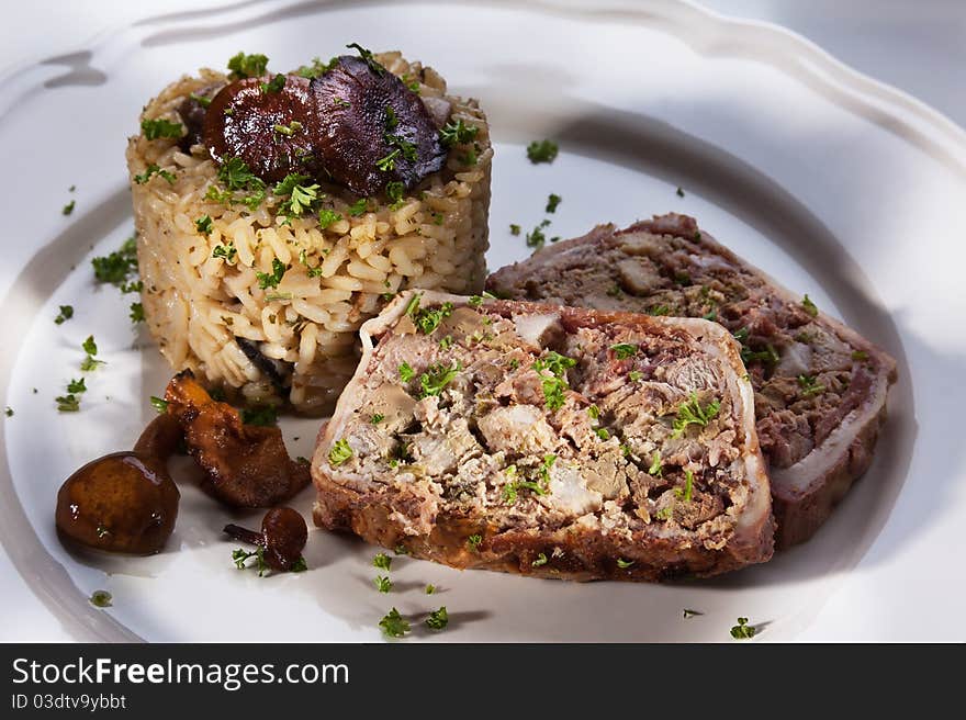 Rustic liver pasty with risotto on a plate