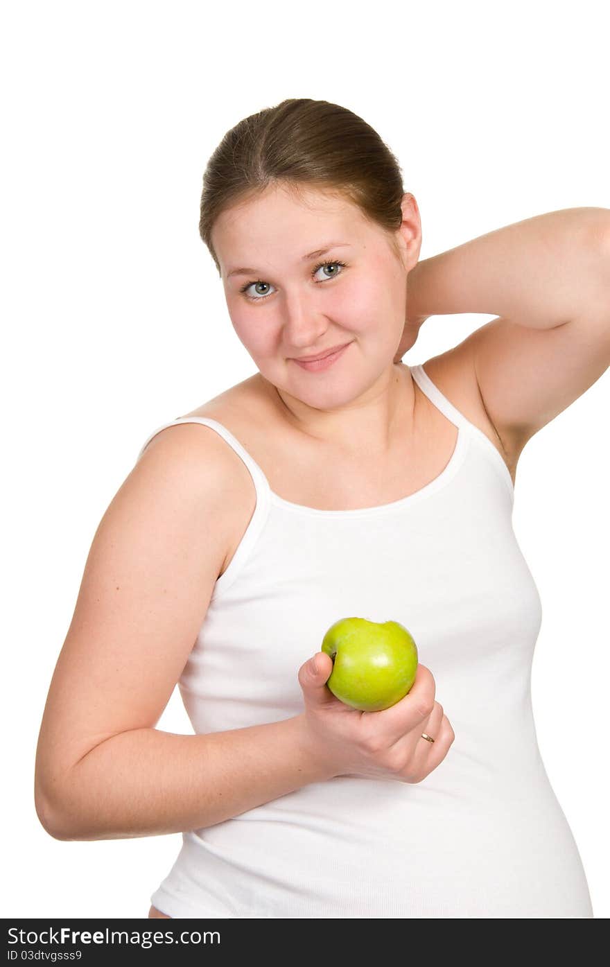 Young pregnant woman with apple over white. Young pregnant woman with apple over white