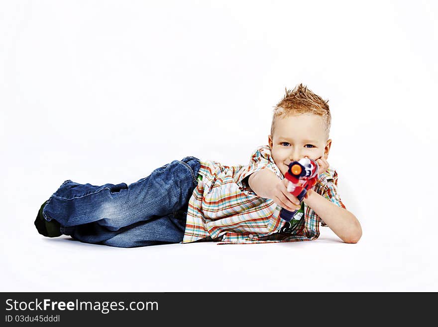 School boy with his colorful toy gun. School boy with his colorful toy gun