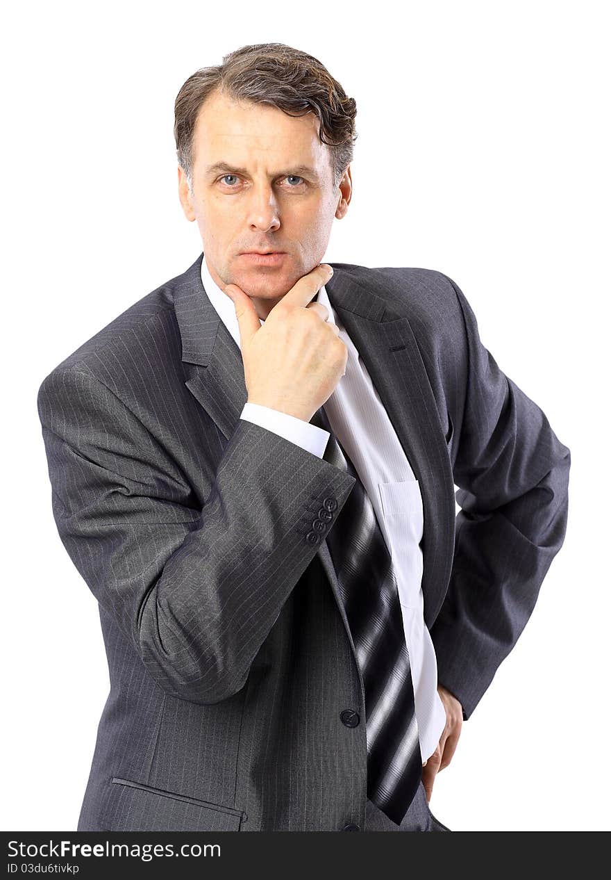 Portrait of a successful mature business man standing with folded hand on white background. Portrait of a successful mature business man standing with folded hand on white background