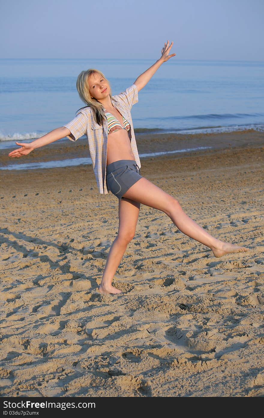 Delighted girl on beach