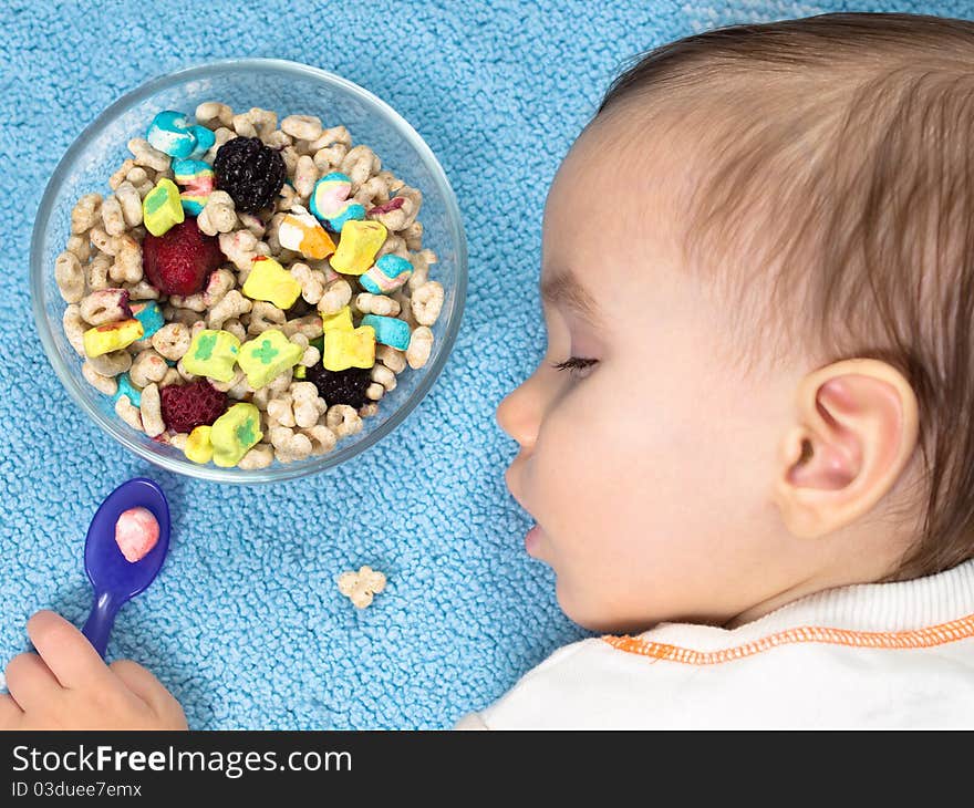 Tired Baby Boy falls asleep after eating cereal from bowl. Tired Baby Boy falls asleep after eating cereal from bowl.