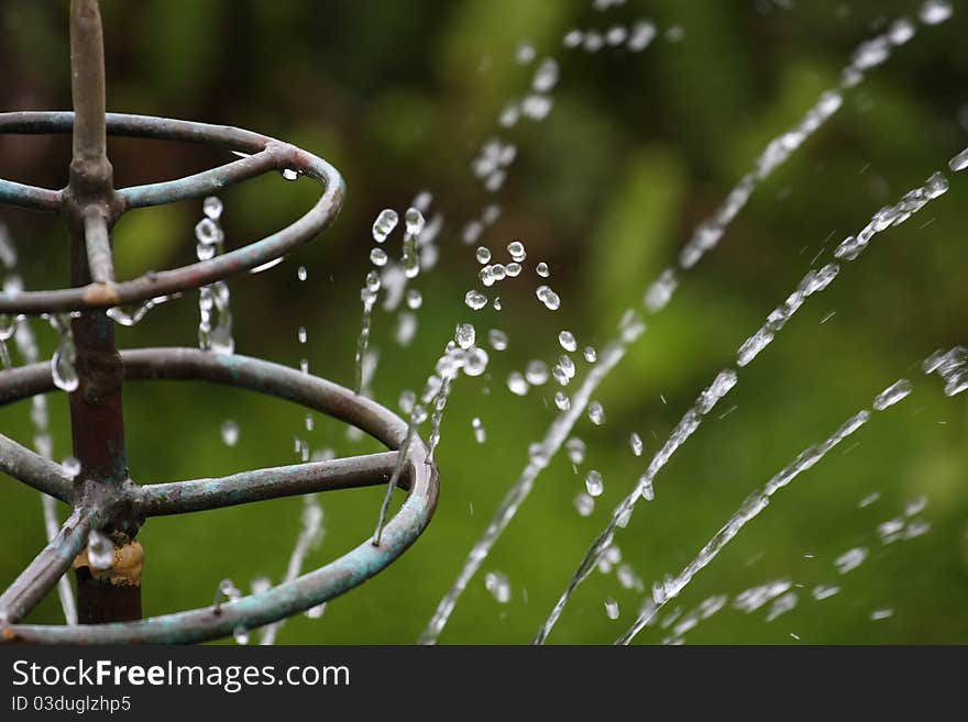 Old twisted water fountain from a pond. Old twisted water fountain from a pond