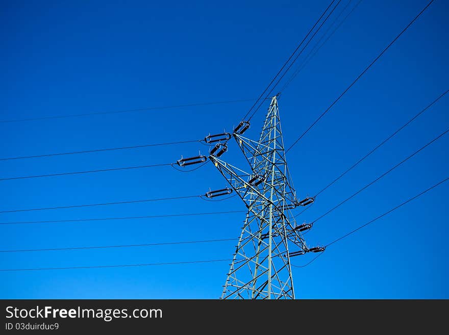 Electrical pylon silhouette and clear blue sky. Electrical pylon silhouette and clear blue sky