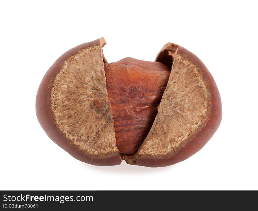 Chopped hazelnuts in the shell on a white background. Chopped hazelnuts in the shell on a white background.