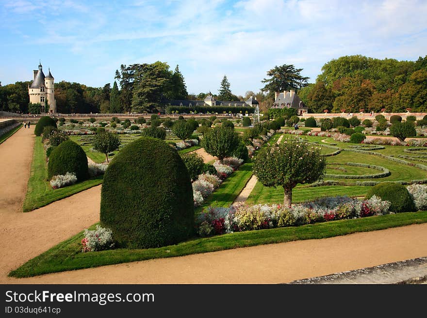 The formal gardens, with flowers, trees and sculpted bushes, at Chateau Chenonceau, Loire Valley, France. The formal gardens, with flowers, trees and sculpted bushes, at Chateau Chenonceau, Loire Valley, France