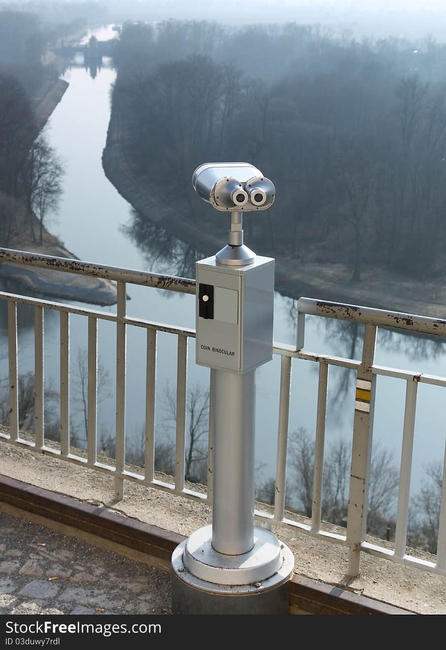 Coin operated telescope looking out Canal Vltava - Labe in Melnik. Coin operated telescope looking out Canal Vltava - Labe in Melnik