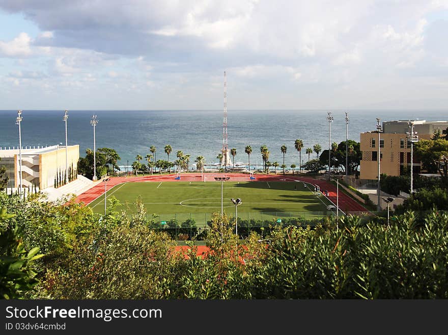 A footbal playground in a university near the sea. A footbal playground in a university near the sea